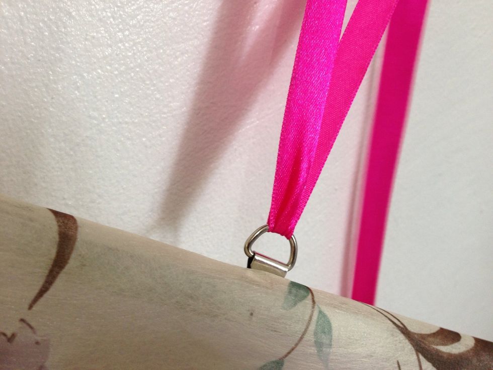 My magnetic whiteboard has string holders so I took that gorgeous lace from the Bath & Body gift box that I received and tied both ends on them. My makeup palette now hanging by my bedroom mirror.