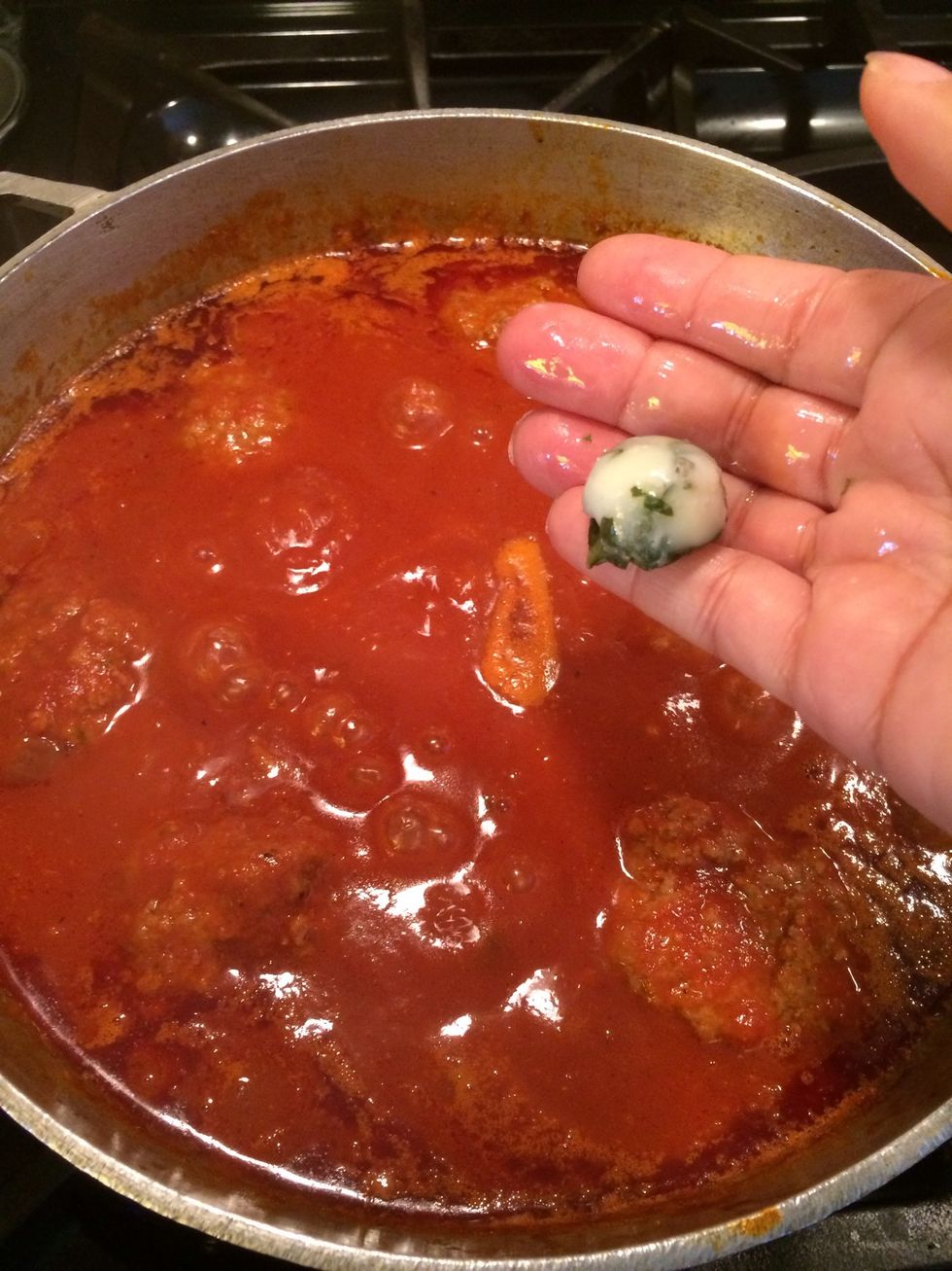 My meatballs have cooked and my sauce is almost done but first I will add more basil to my sauce. This adds another dimension of flavor to the sauce. I love the flavor of basil.