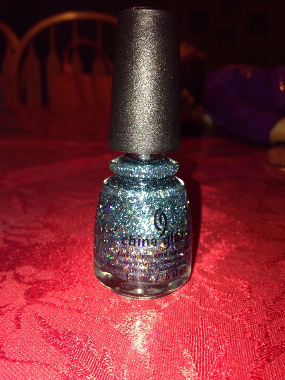 My middle nail wasn't dry and I pre-did my ring finger. I'm using a glitter polish from China Glaze called Bells Will be Ringing (1259).