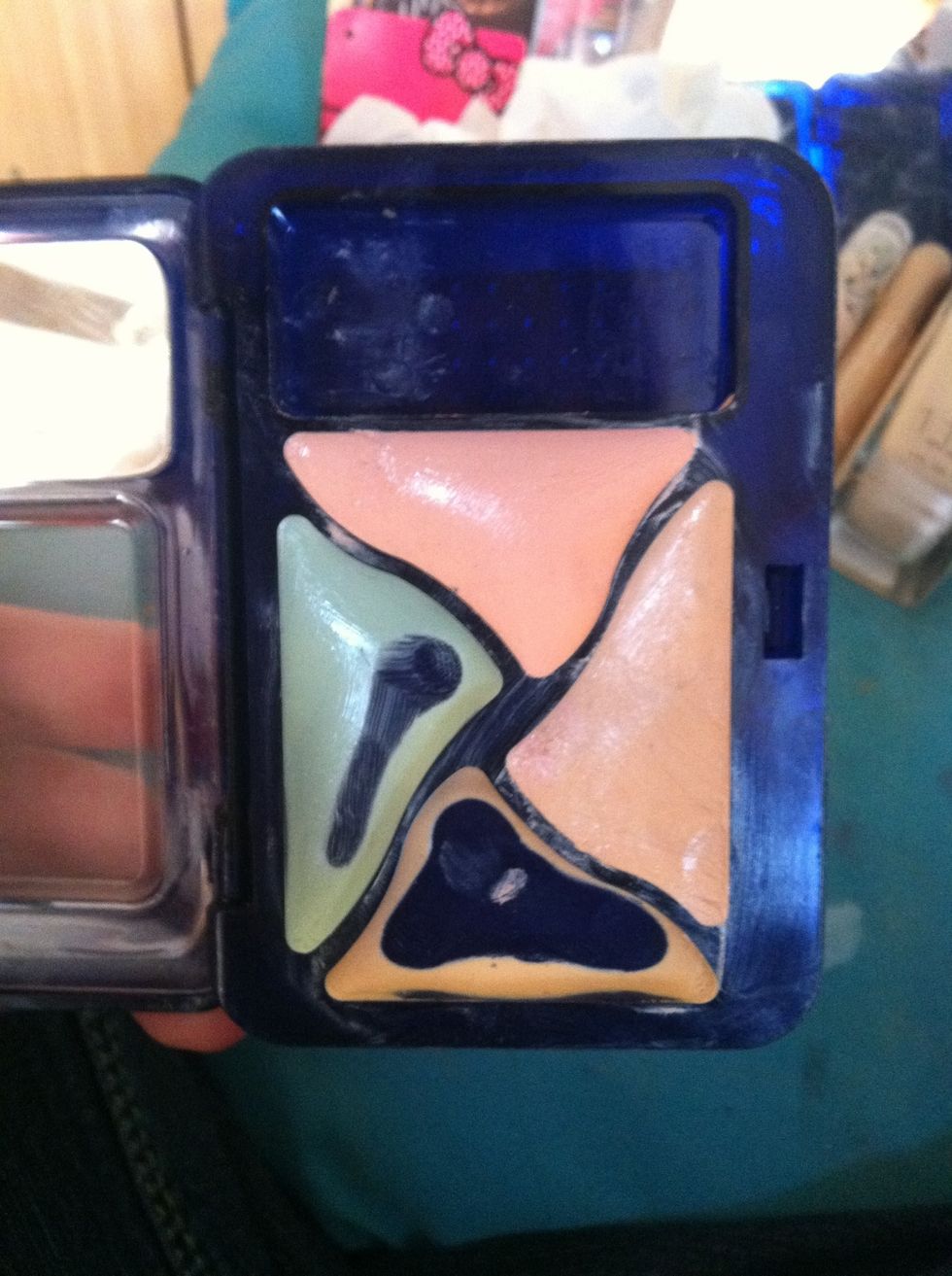 My sad concealer palette. I don't even know the brand. Green for red spots. Pink for under eye circles. Yellow for dark spots. Skin tone to blend.