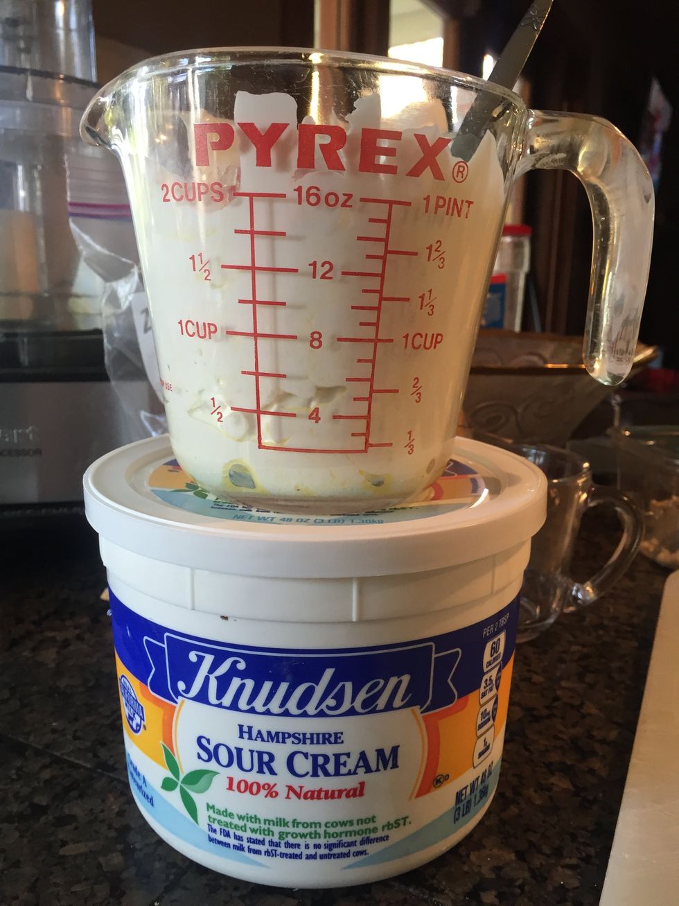 My sister has substituted 2 cups of Greek-style yogurt for the sour cream, and she says she can't tell the difference.
