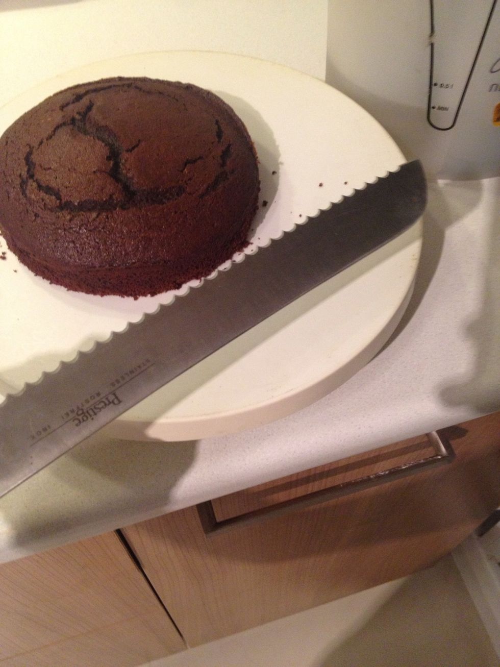 My smaller pan is a bit tall so i'll cut it in half. Tip \ud83d\udca1use the bread knife. The teeth helps cutting through cakes better than normal ones. And if you have one of the spinning cake table, use it.