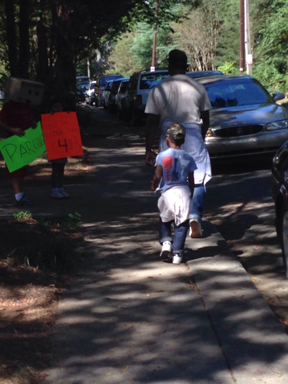 My son and his dad! Lead you child in the way you want them to go! Side note box head kids were selling $4 parking tickets to park visitors of the festival!