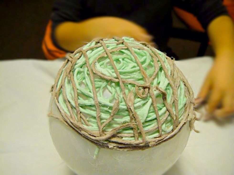 My son working on his design.