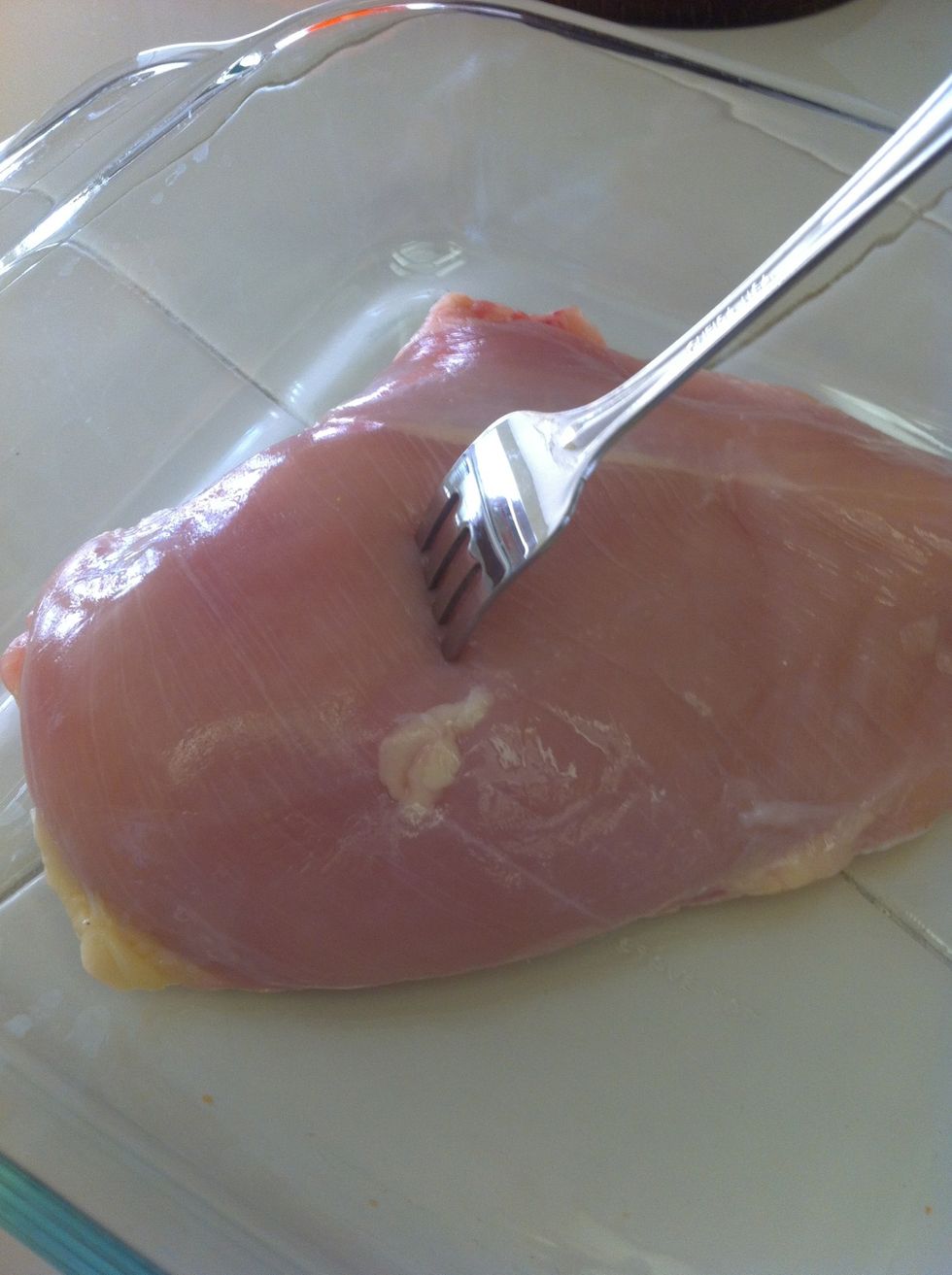 My special trick to flavorful and juicy chicken is to "Fork" it. Take a fork and pierce the breast all over, left and right, up and down!