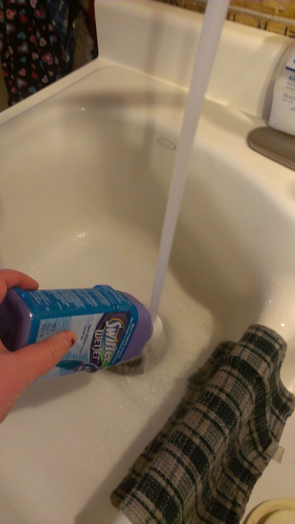 My water gets very hot so I just hold the lid under very hot running water. If your water isn't hot enough you can boil water and hold the lid in the water. Then just twist off the lid.