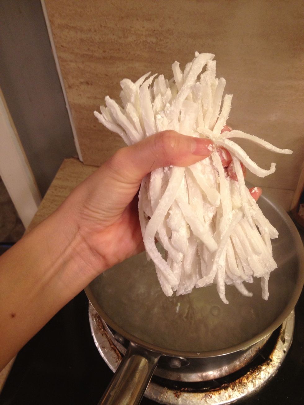 My water is ready so I'm dropping the noodles in. It takes about one minute or two and it could boil over if you don't keep an eye on them. Do NOT overcook them please!