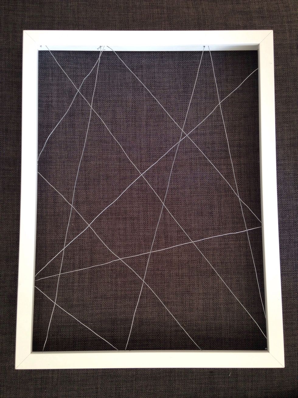 Nail around the edges and then wrap the metal string around the frame!