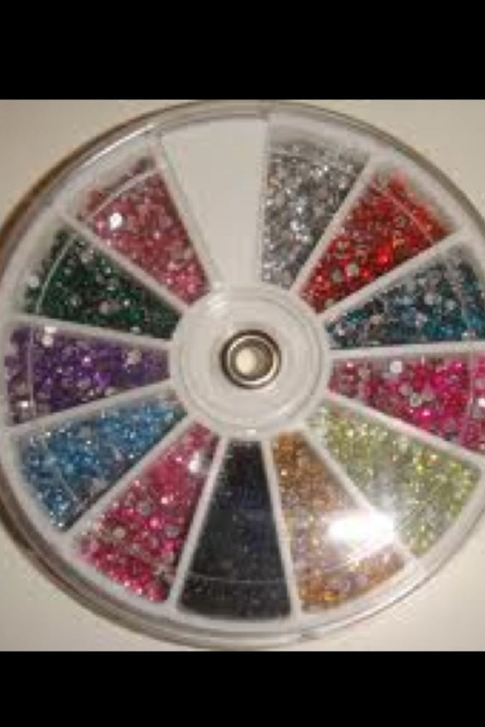 Nail gems!!! Very easy to use, after you have your base color add clear coat and stick them on while it's wet. Reapply clear coat over gems. Cost 1-4$ on eBay.