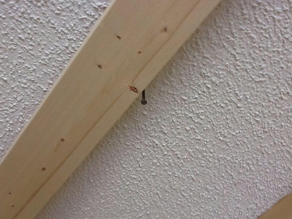 Nail is the space from the wall and also is located on a joist. The edge of the mounting bracket is 1/2 the of the distance of the handle bar length plus about 2 inches.