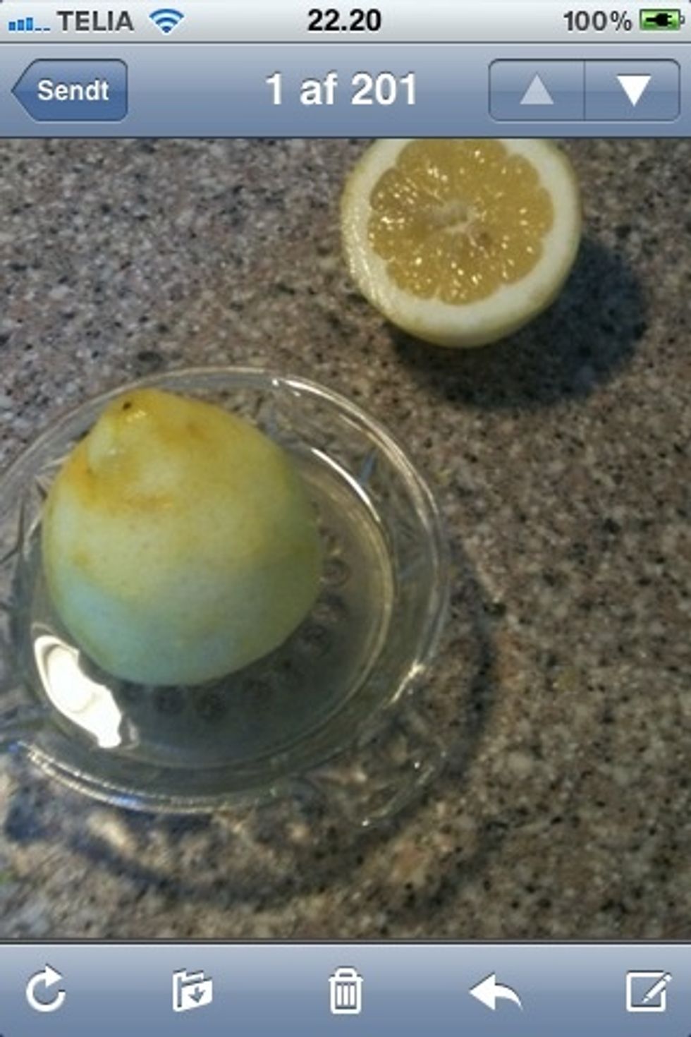 Naked lemon beeing squeezed