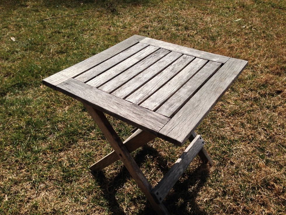 Nasty dirty teak table.