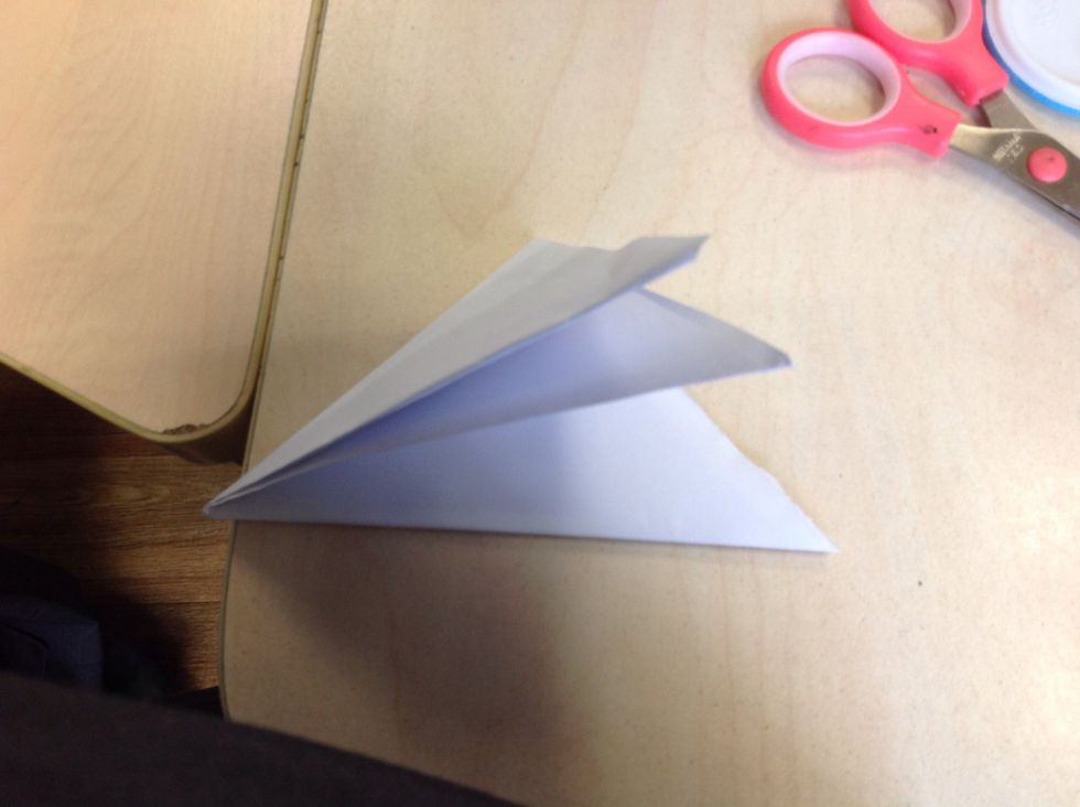 Naxt fold the little triangle to another little triangle.