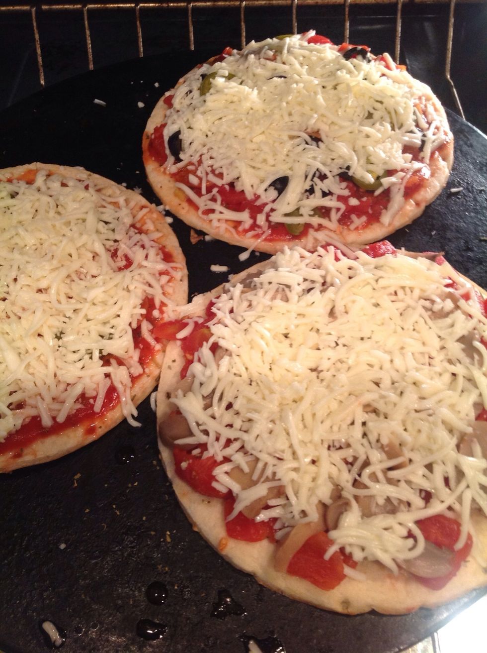 Nestle the pizza toppings under a layer of mozzarella cheese. Be creative with your cheeses if you like - my crew likes to keep things simple.