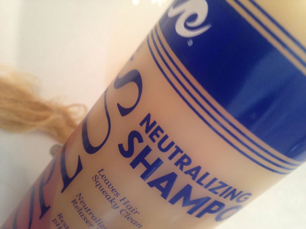 Neutralizing Shampoo will instantly stop the chemicals from processing further. The shampoo turns pink when applied to the bleach mix. Wash the hair until the shampoo is white. Then rinse.