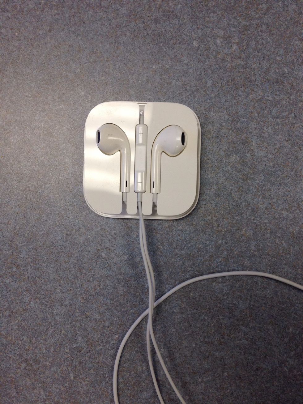 New get the right EarPod cord and wrap it around from the bottom towards the right side just like you did in the 2 previous steps.  Stop once you get to the center place holder.
