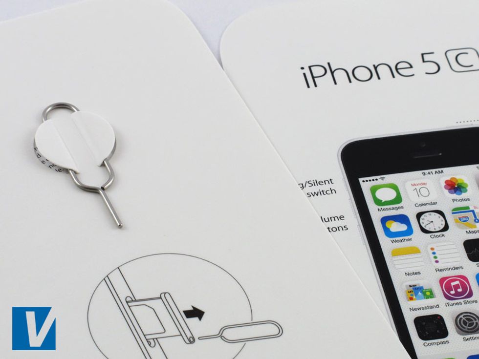 New iPhones 5C's are accompanied by a pin that is designed to help remove the SIM card. Check the tubular shape of the pin which is different to previous iPhone pins.