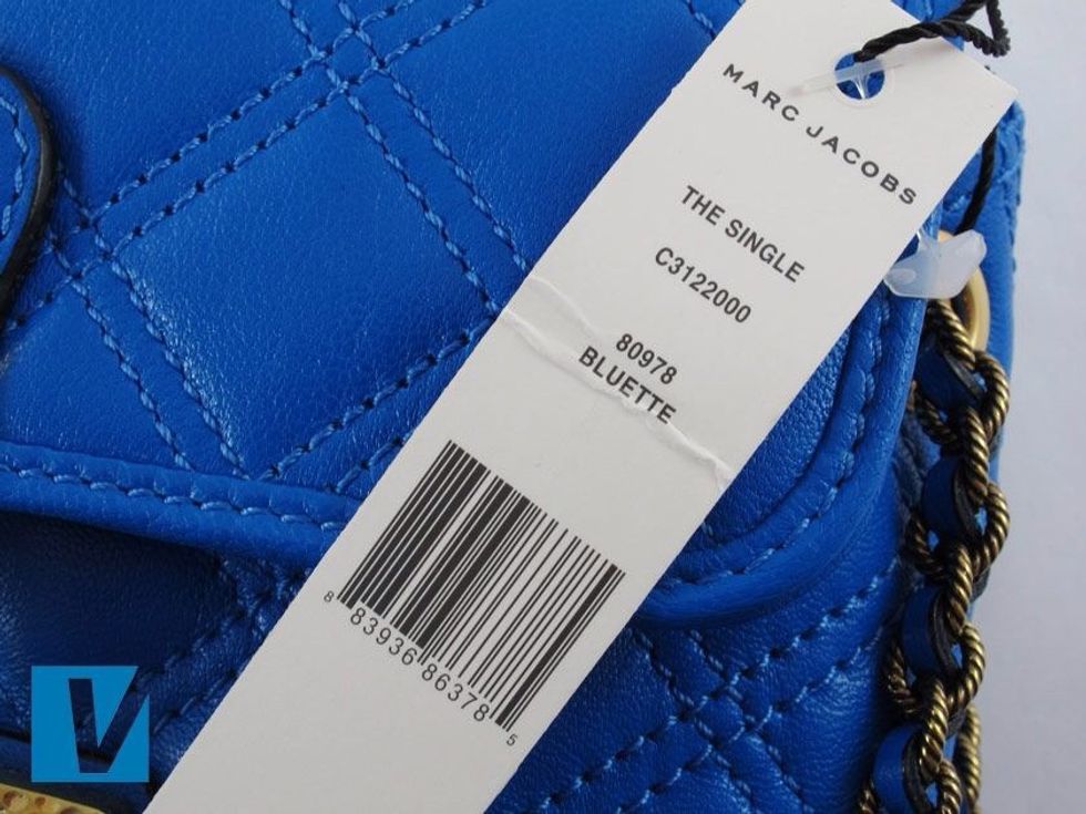 New Marc Jacobs feature a swing tag. It details style and colour information and features a barcode. Beware that real swing-tags can feature on counterfeit handbags.