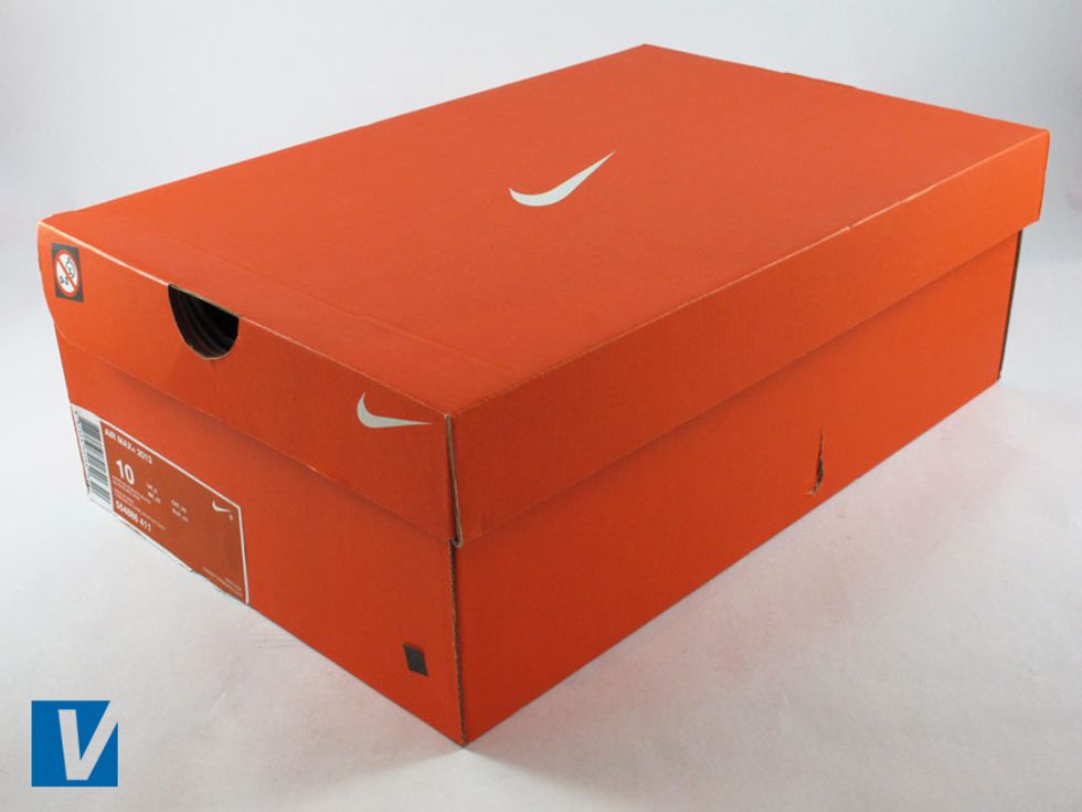New Nikes are boxed in a strong shoe box usually featuring the logo on the lid and side. Colour and style of box varies according to style and year. Remember real shoe boxes can accompany fake shoes.