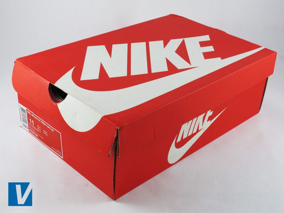 New Nikes are boxed in a strong shoe box usually featuring the logo on the lid and side. Colour and style of box varies according to style and year. Remember real shoe boxes can accompany fake shoes.