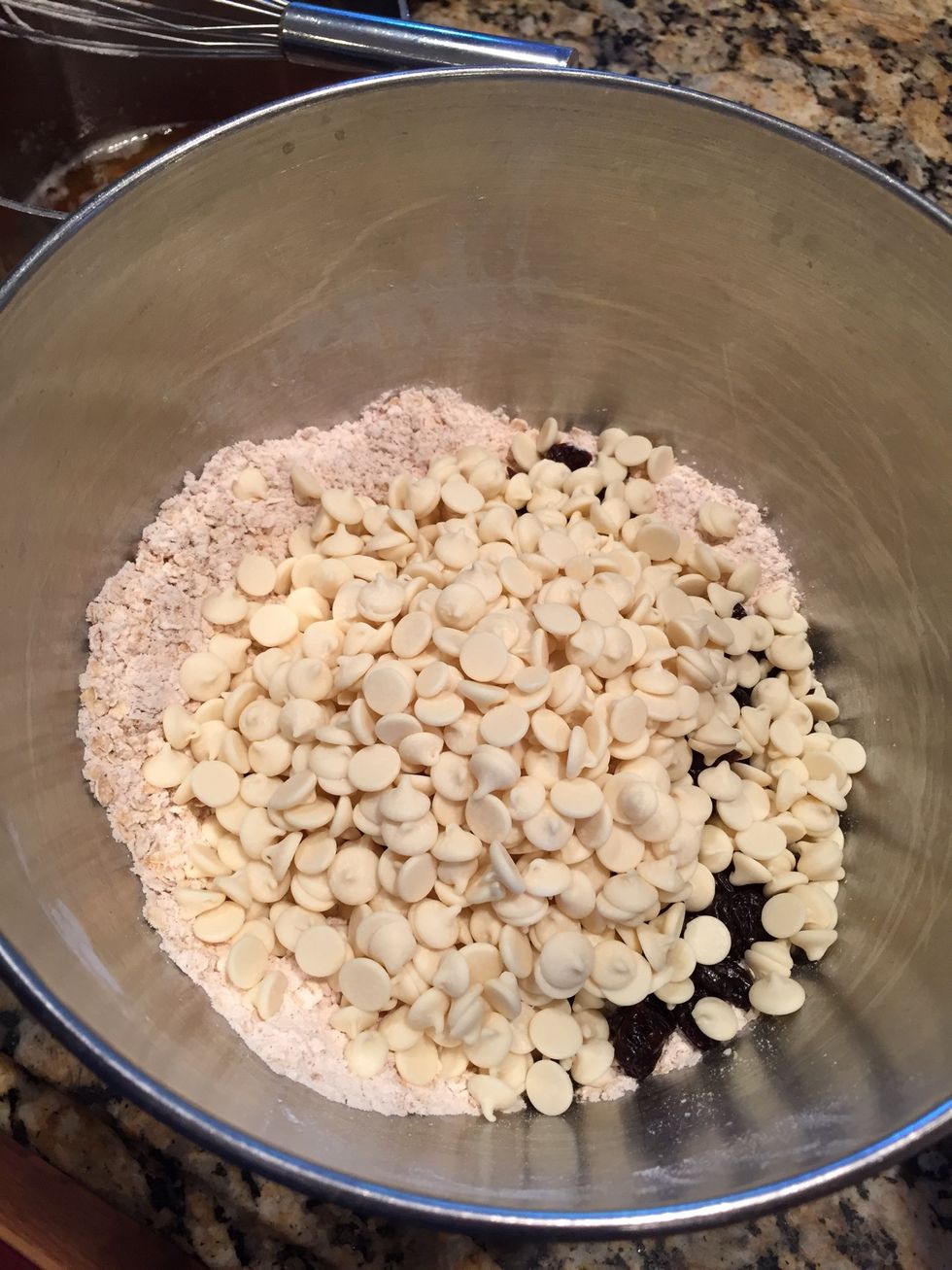 Next add a bag of white chocolate chips. Also, toss to coat