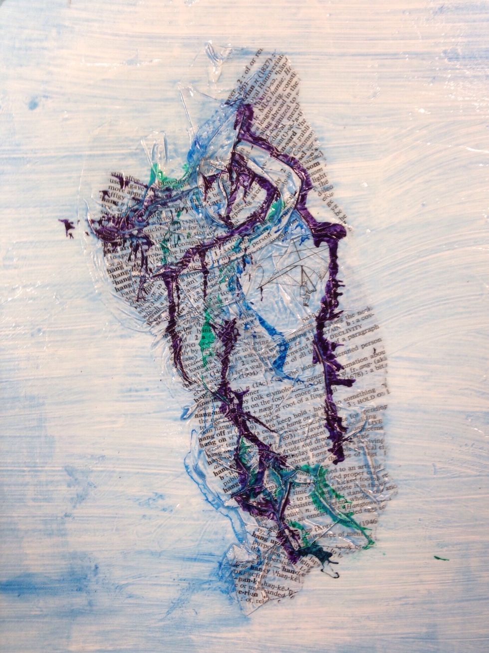 Next add a few drops of liquid India ink and hold the board vertically. The ink will follow the textural lines of the wrinkled surface.