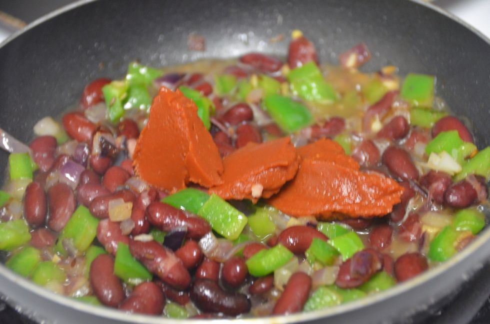 Next add beans(even the mashed ones) and tomato pur\u00e9e .. And 1/2 cup water. Mix well. Add the seasoning , salt and cayenne pepper.