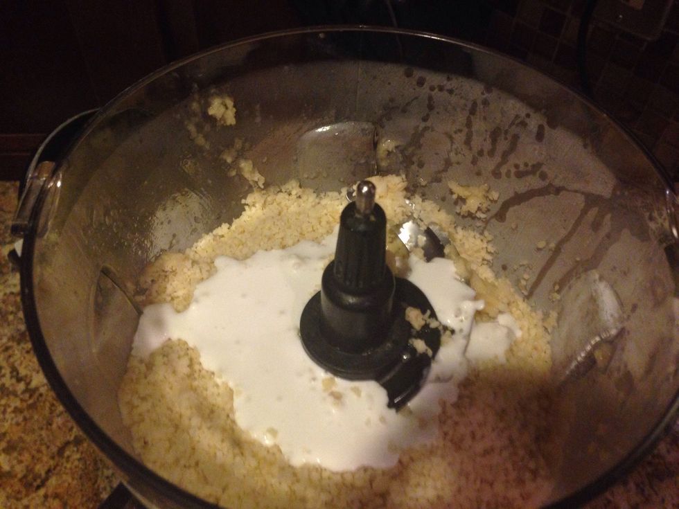 Next add coconut milk to the blended bananas