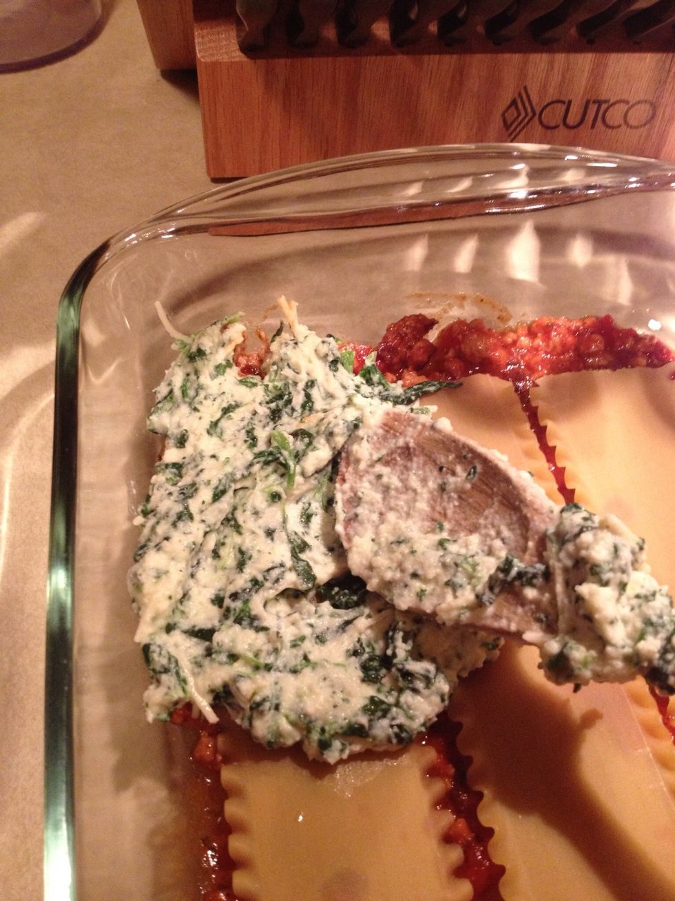 Next add half of the ricotta mixture.