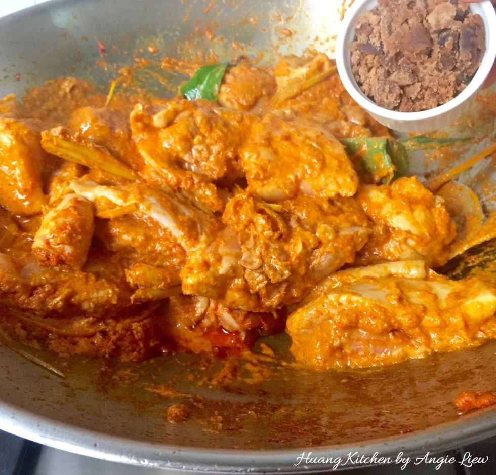 Next, add in palm sugar (gula melaka) or sugar. Continue stirring occasionally as you bring the curry to a boil.