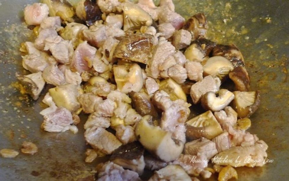 Next add in the marinated chunks of pork and give a stir to mix everything together.