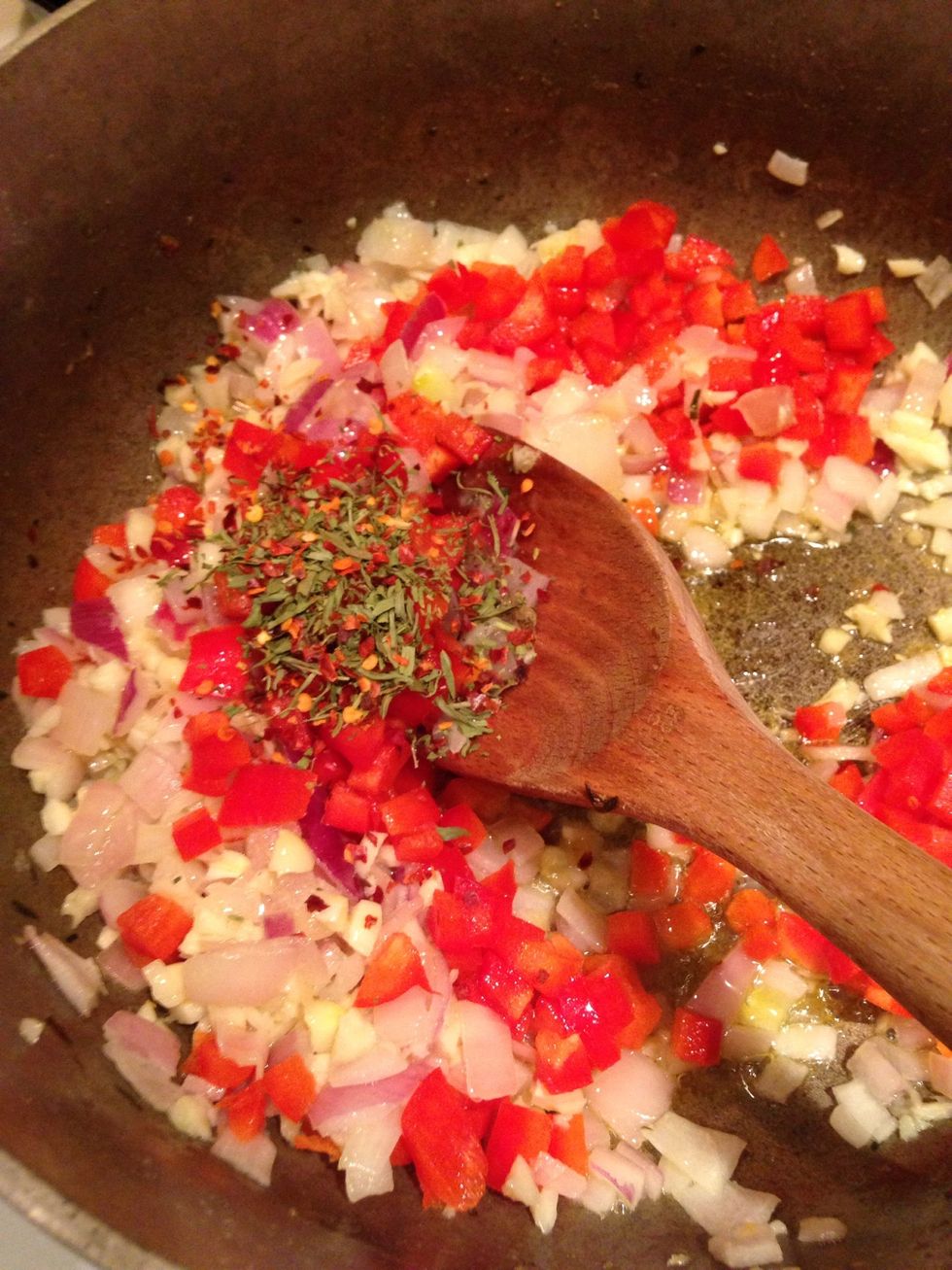 Next add in the red pepper, seasoning, salt and pepper and cook for another two minutes.