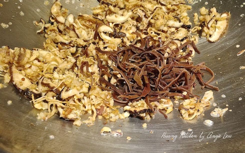 Next add in the strips of mushrooms, black fungus and preserved radish. Fry for about 2 minutes.