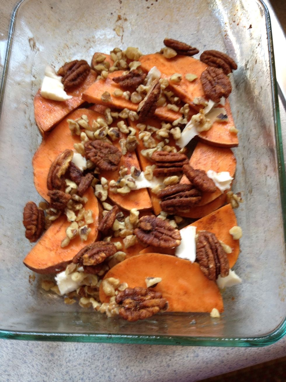 Next add nuts. Walnuts and pecans go perfectly! I added a few pieces of butter on top as well. Place in oven at 350 for about 20 minutes