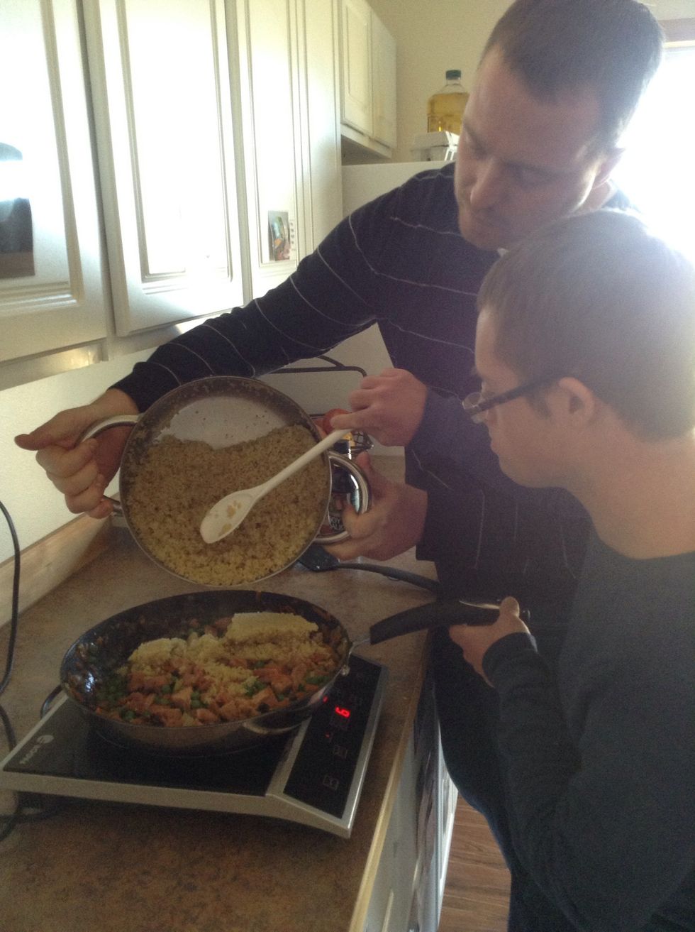 Next add quinoa to skillet. Use a large spoon to help you scoop the quinoa.