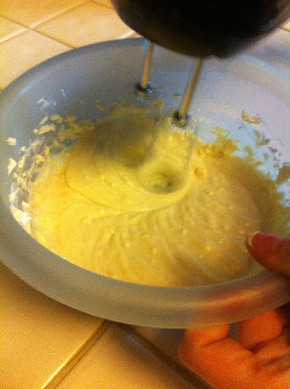 Next, add sugar as you are mixing, then the egg and vanilla. Mix until it is blended well