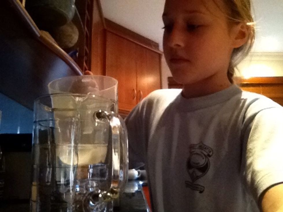 Next add the 1 litre of water to the big jug.