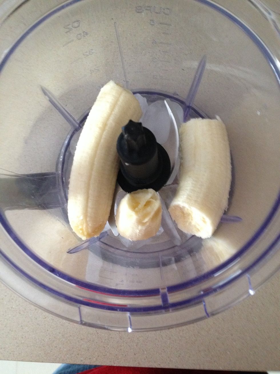Next add the banana, don't worry about cutting it up first, the blender will do that for you