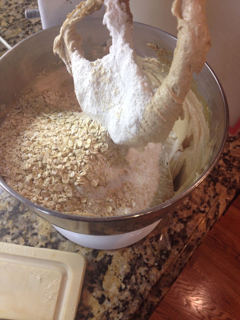 Next add the dry: 1/3 c oats, 1 1/2 c flour, 1 tsp baking soda, and a pinch of salt. Gently blend