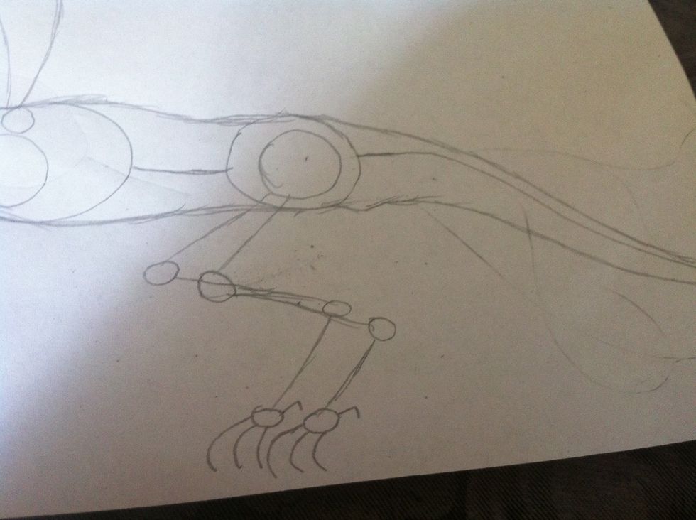 Next add the legs in the back and the feet