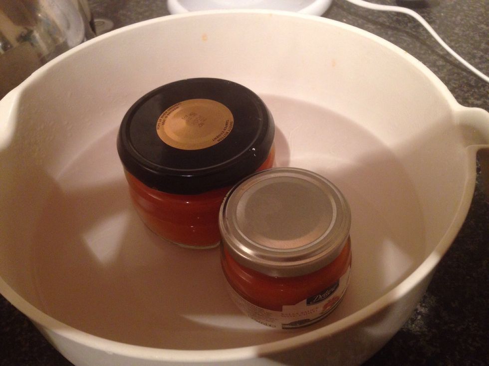 Next add the lids and screw on tightly. Leave to cool. When the jar and mix cools it creates a pop seal on your jars. This re-breaks once opened. Unopened they are now preserved with an intact seal.
