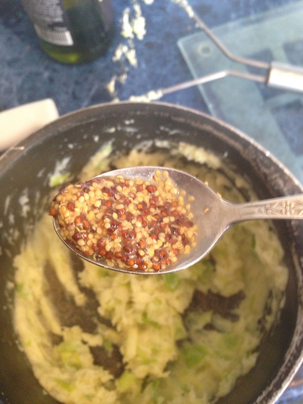 Next add the mustard and continue mashing until nice and smooth