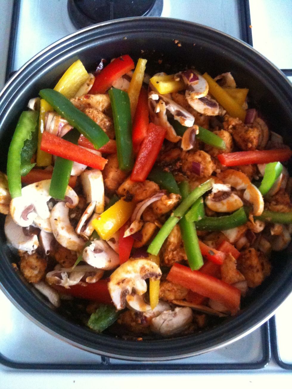 Next add the onions, mushroom and then the peppers keep stirring so they all mix together mmmm smells yummy