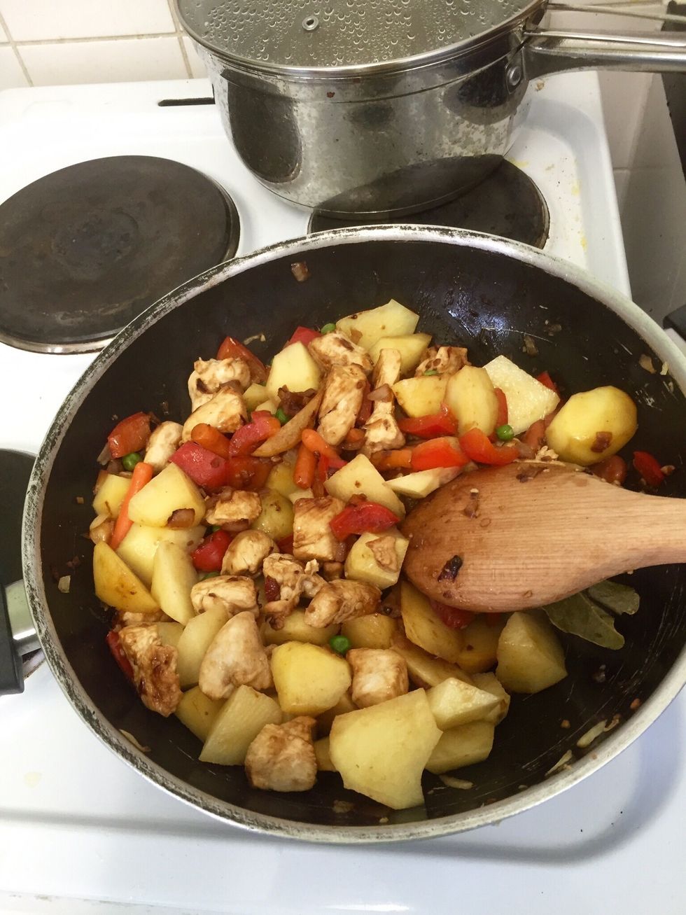 Next add the potatoes and let them cook a bit with everything