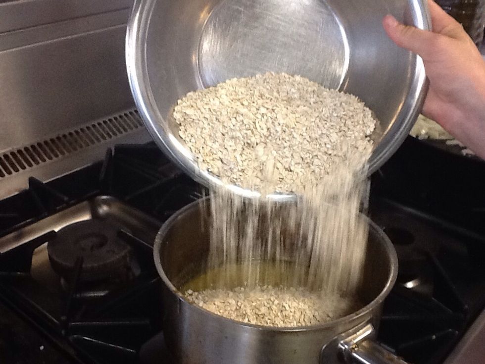 Next, add the rolled oats into the mixture And stir in.
