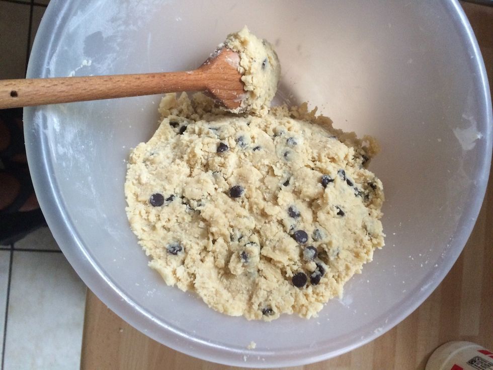 Next add the salt, vanilla extract and chocolate chips and stir until the mixture forms a firm dough.