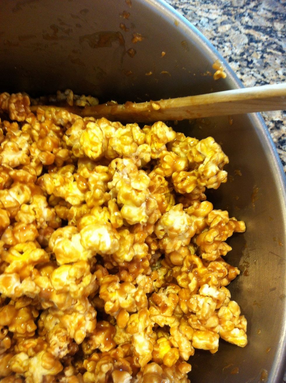 Next add the second batch of popcorn to the large bowl, pour the rest of caramel and stir well. Coat every piece of popcorn
