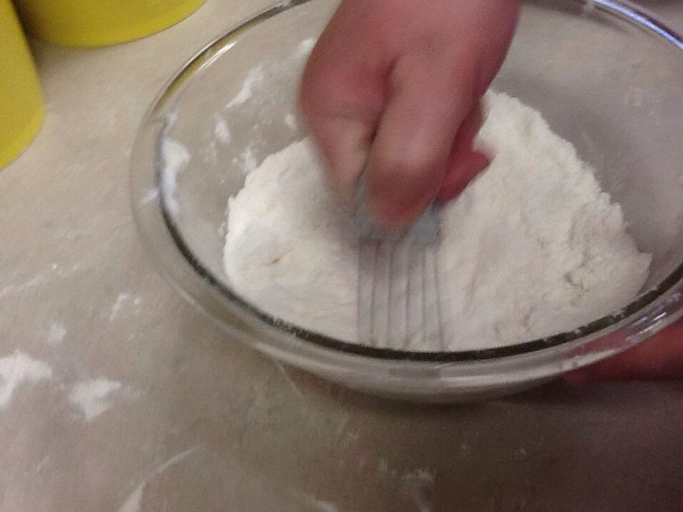 Next add the shortening and make sure to use a pastry blender to even out the shortening.