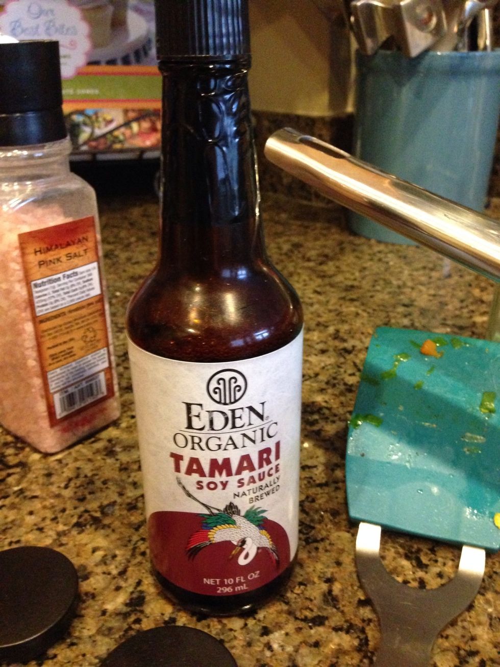 Next add the Soy Sauce. I used about 1/4 cup because I made 6 servings of rice. If you are making a smaller batch, try 4-6 T instead. Turn the heat down to med-low.