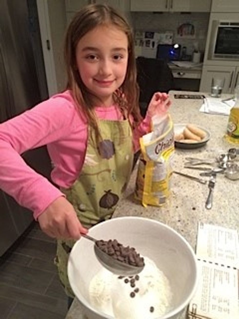 Next, add the sugar and baking powder. Then add the salt and chocolate chips.